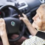 senior woman driving car